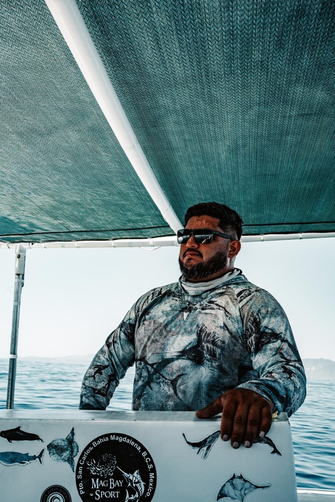 Local captain at the helm of an ocean safari boat in La Ventana