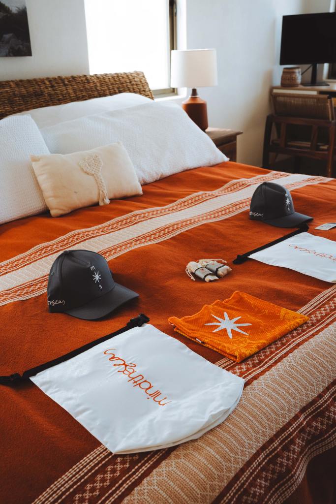 Mind the Seas expedition welcome materials arranged on a wooden table in La Ventana