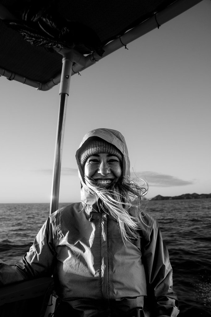 Guest aboard a boat during a Mind the Seas expedition in Magdalena Bay